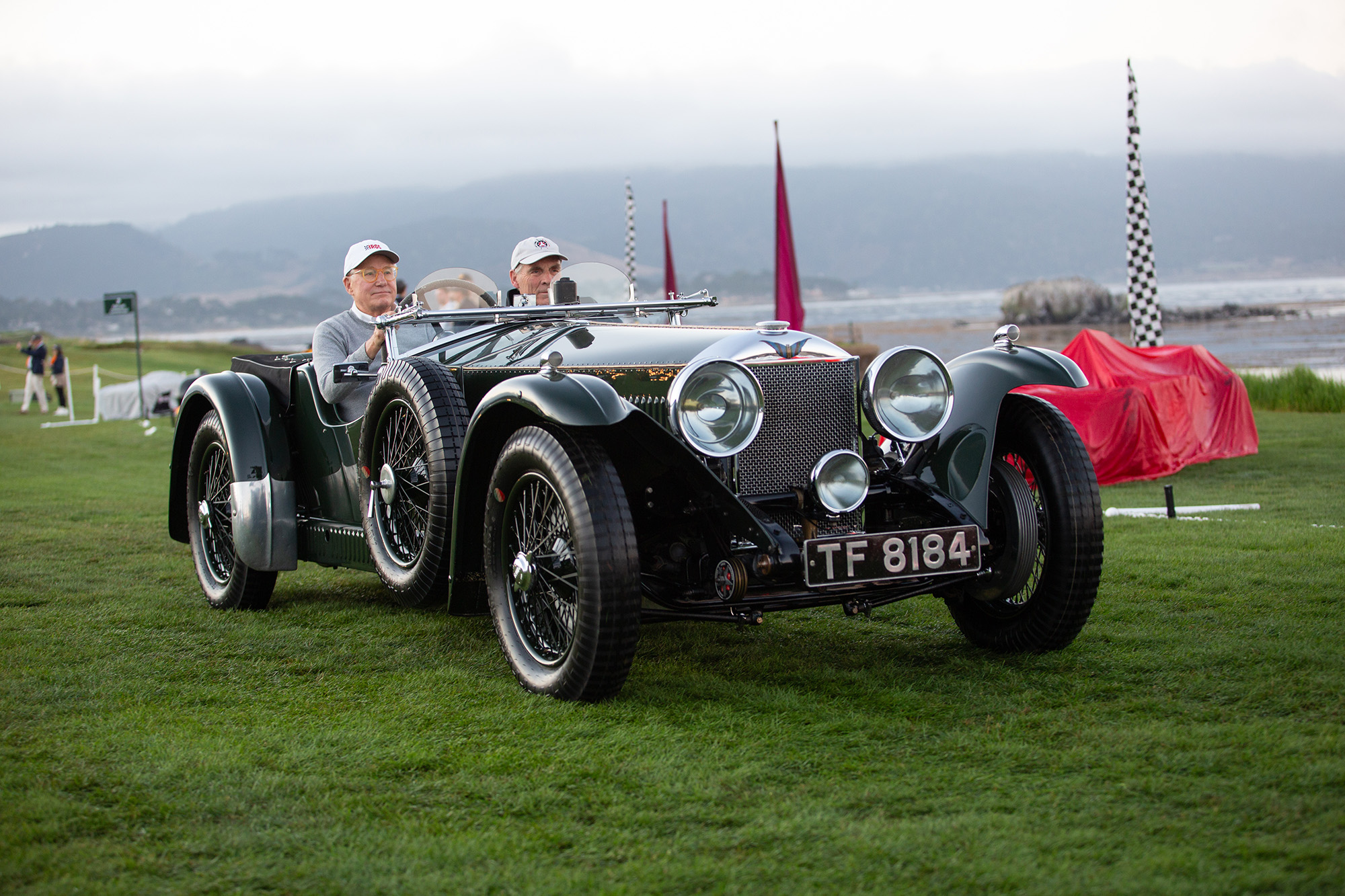1932 Invicta 4 1/2 Litre S Type Tourer, front quarter, driving on the Pebble Beach grass