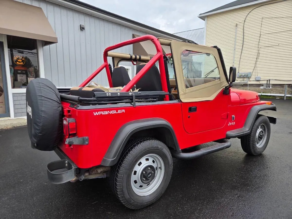red 1991 Jeep Wrangler rear quarter