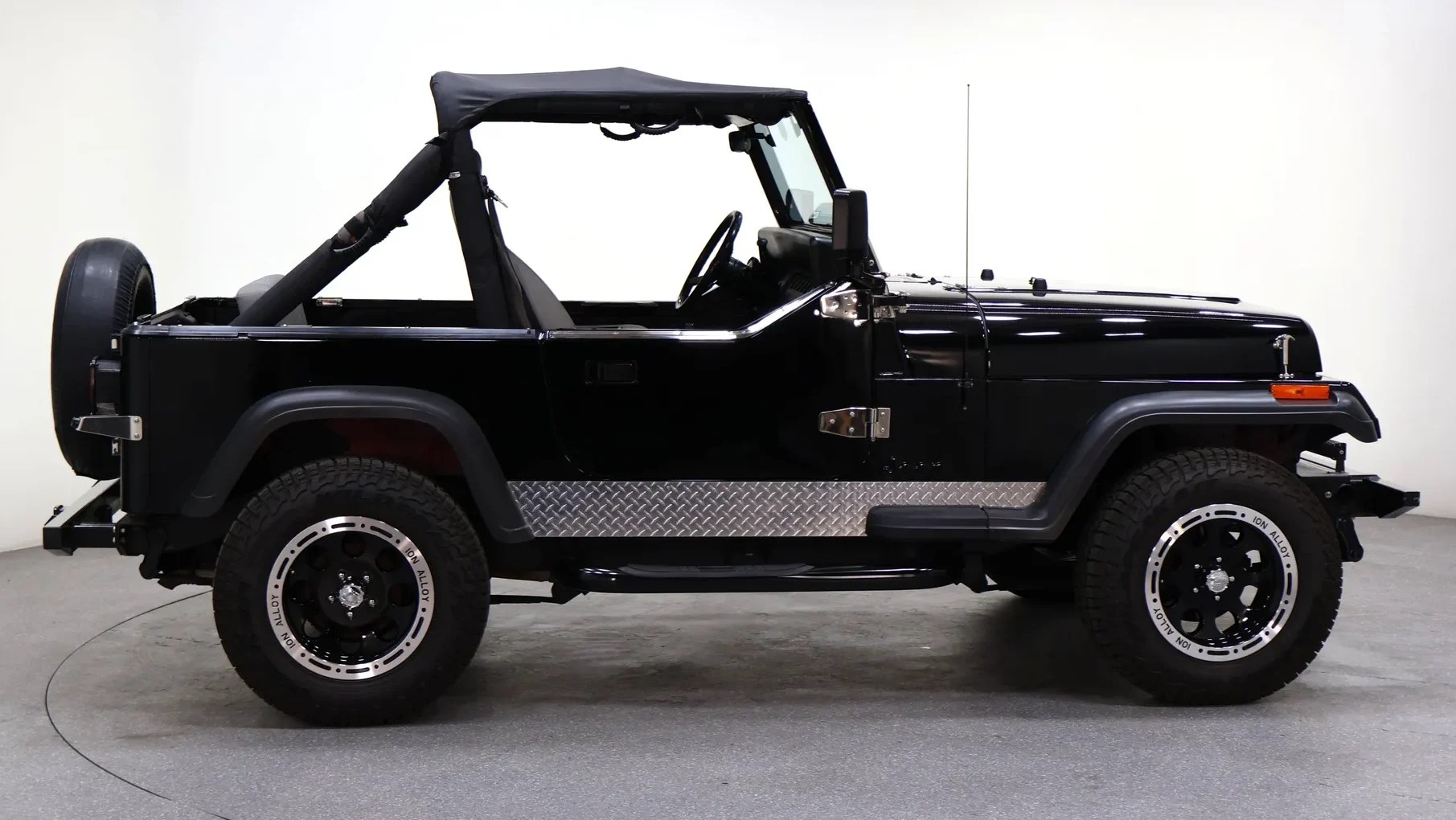black 1987 Jeep Wrangler profile