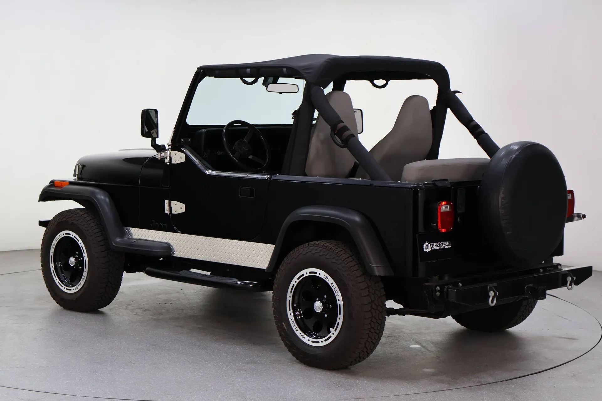 black 1987 Jeep Wrangler rear quarter