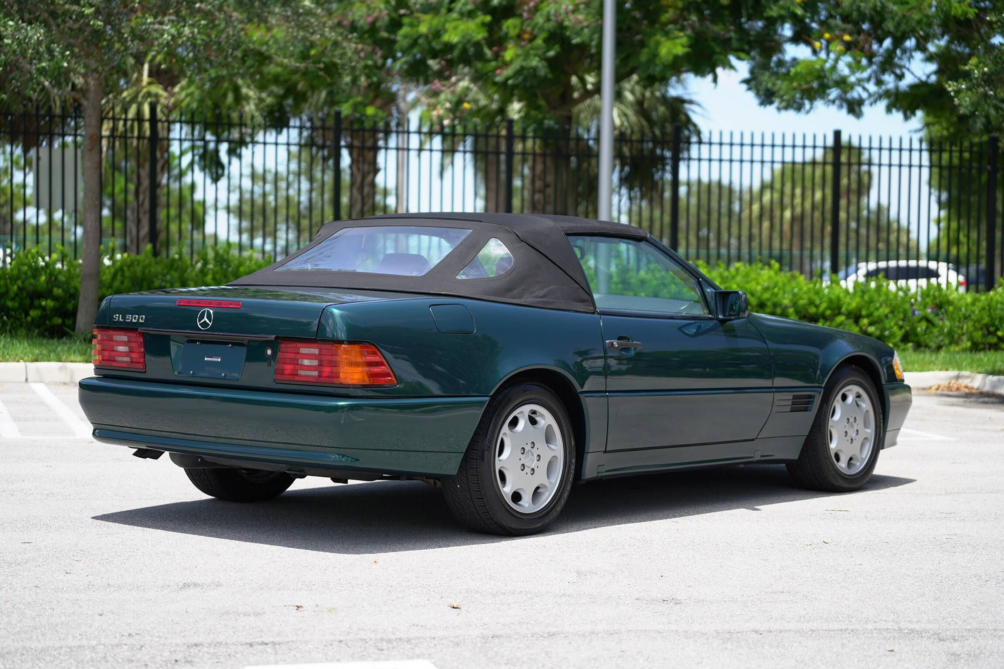 1995 Mercedes-Benz SL500, rear quarter, green with a black top, top up