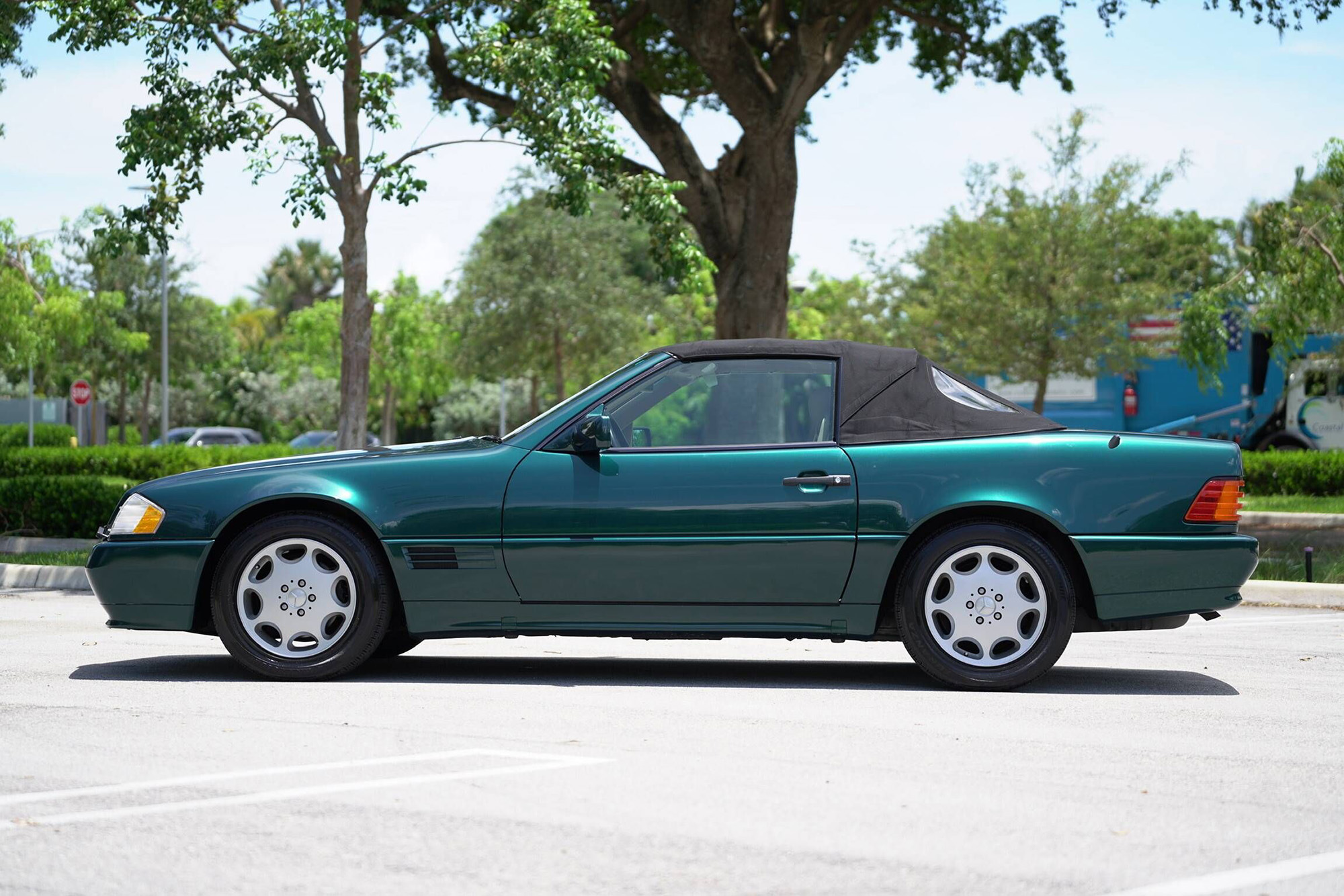 1995 Mercedes-Benz SL500, side view, top up, green with a black top