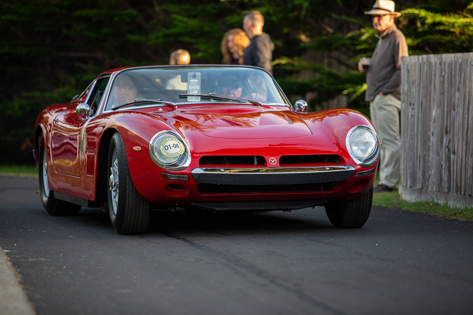 1967 Bizzarini 5300 GT Strada Berlinetta, front view, on a paved path leading to Pebble Beach concours show field