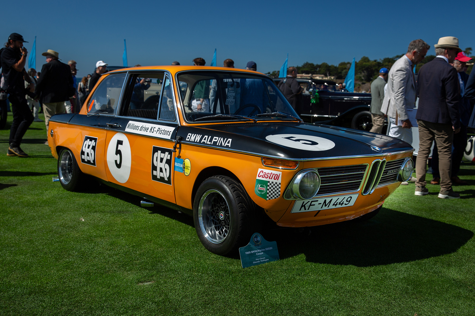 1969 BMW Alpina 2002ti, front quarter, on the grass at Pebble Beach