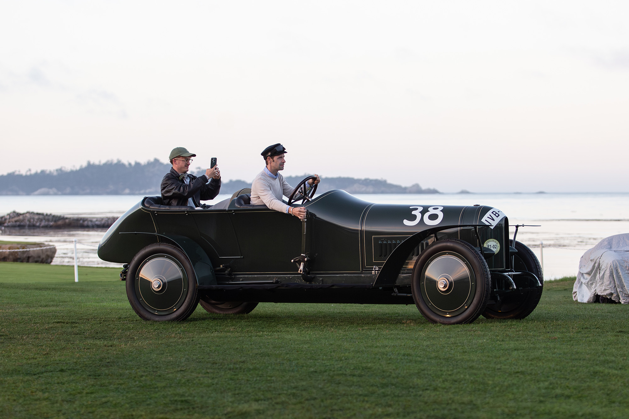 1910 Benz 21/80 Renn Wagon, side view, car driving on the grass at Pebble Beach Concours