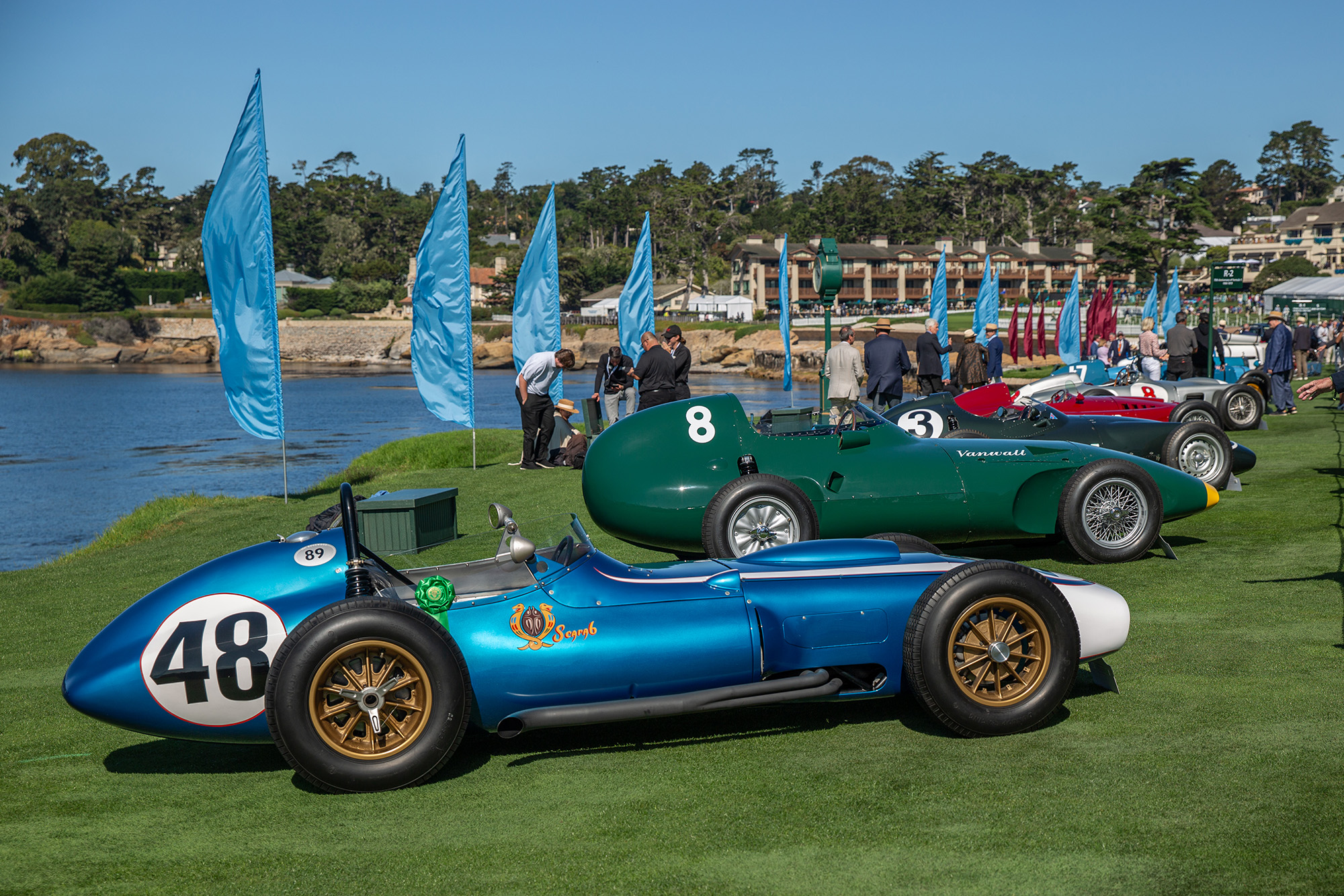 1960 Scarab Formula 1, side view, with other period F1 cars behind it, on the show field at Pebble Beach