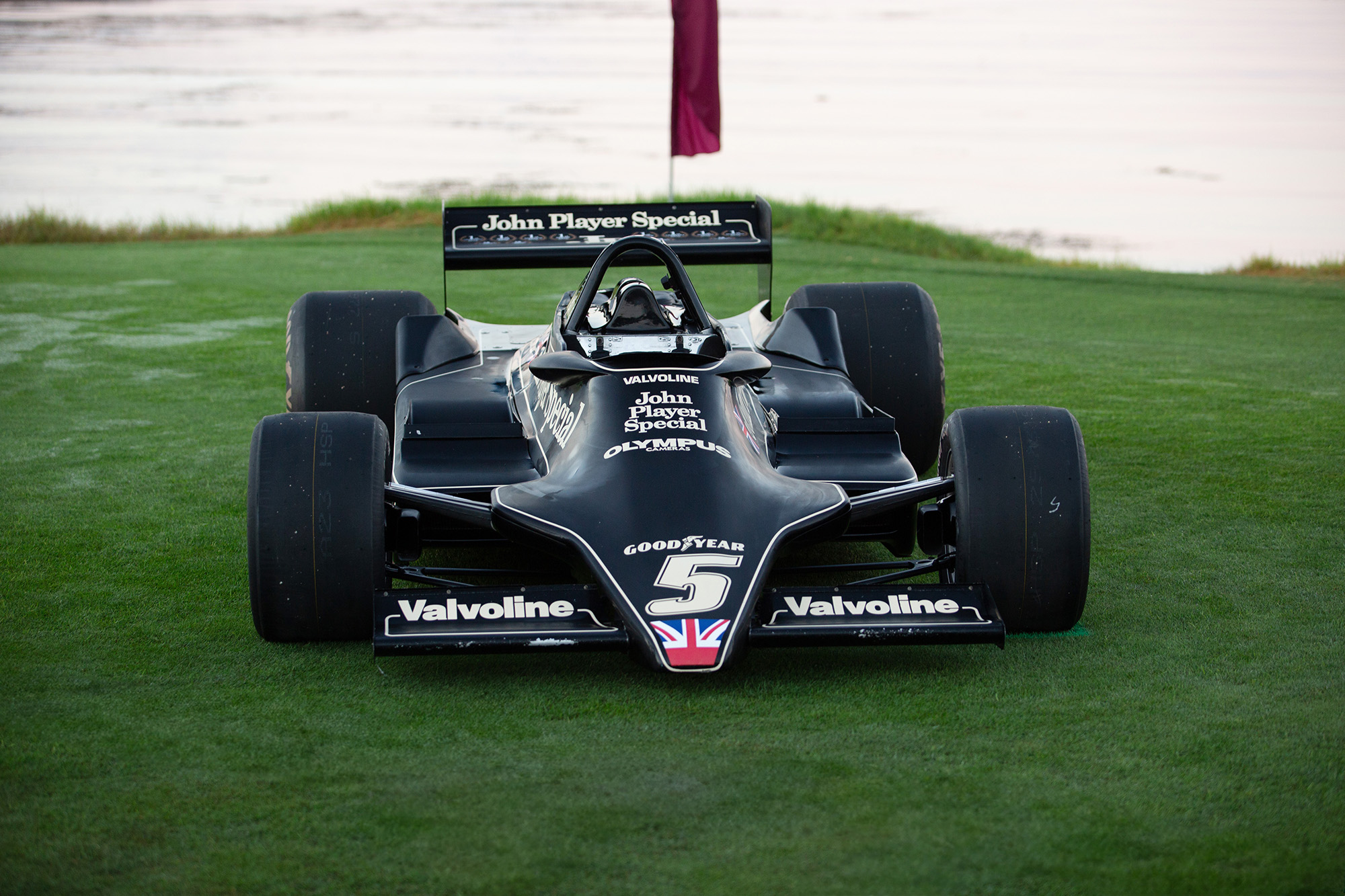 1978 Lotus Type 79, front view, on the grass at Pebble Beach with the ocean behind it